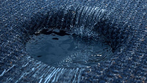 Close-up of dark blue UV resistant marine carpet demonstrating fast water drainage and moisture resistance.